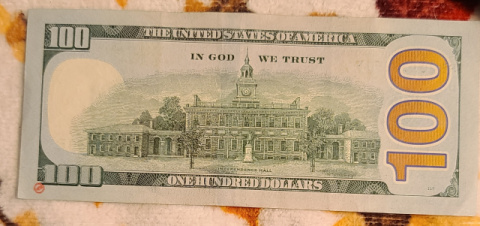 100-Dollar-Bills-With-Small-Ink-Stamps-On-The-Reverse