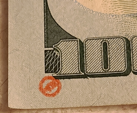 100-Dollar-Bills-With-Small-Ink-Stamps-On-The-Reverse