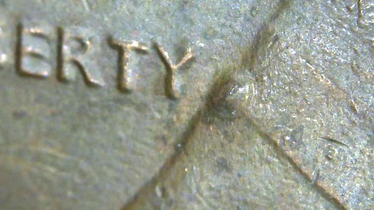 1982-LMC-Strange-Raised-Circles-On-Obverse