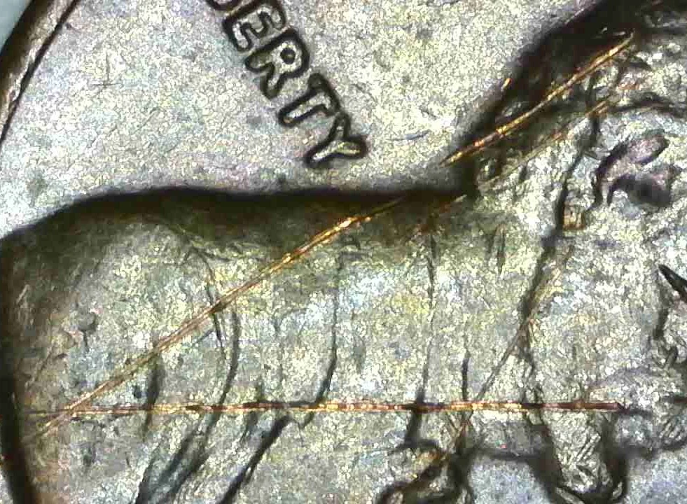 1982-Penny-Marks-On-Rim-And-Others-Damage?