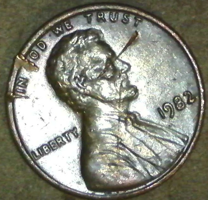 1982-Penny-Marks-On-Rim-And-Others-Damage?