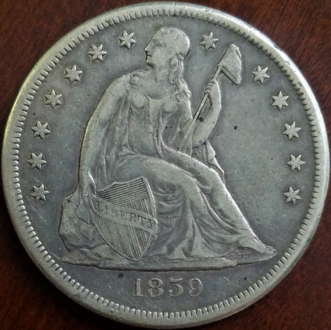 My-First-Seated-Dollar,-1859-O