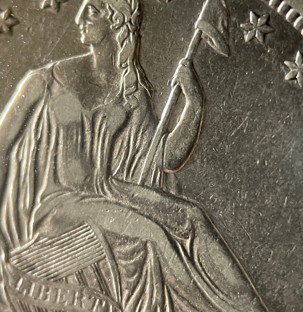 Something-A-Little-Curious-On-This-1839-No-Drapery-Seated-Liberty-Half