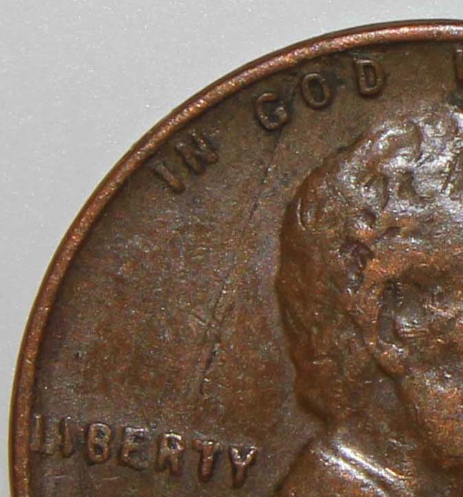 Damaged-Planchet-Or-Strike-Through-On-1944-Lincoln-Cent?