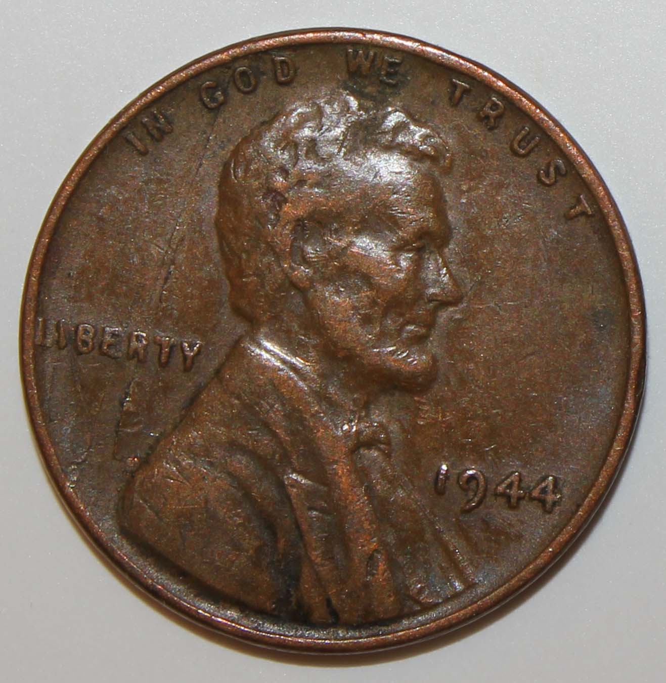 Damaged-Planchet-Or-Strike-Through-On-1944-Lincoln-Cent?