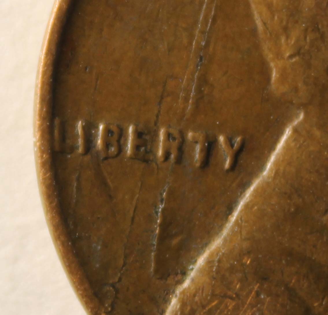 Damaged-Planchet-Or-Strike-Through-On-1944-Lincoln-Cent?
