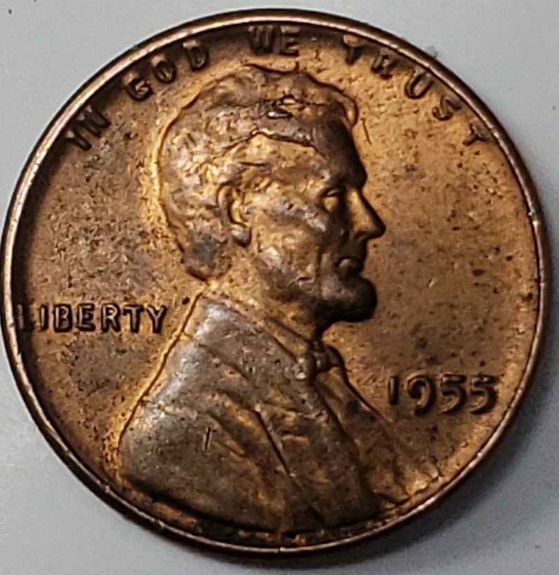 1955-1-Cent.-Slight-Raise-In-Left-Wheat.-Indentation-On-Lincoln-Head.-Any--Info/Cause?