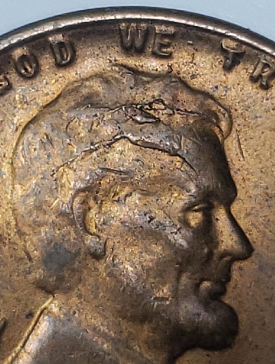 1955-1-Cent.-Slight-Raise-In-Left-Wheat.-Indentation-On-Lincoln-Head.-Any--Info/Cause?