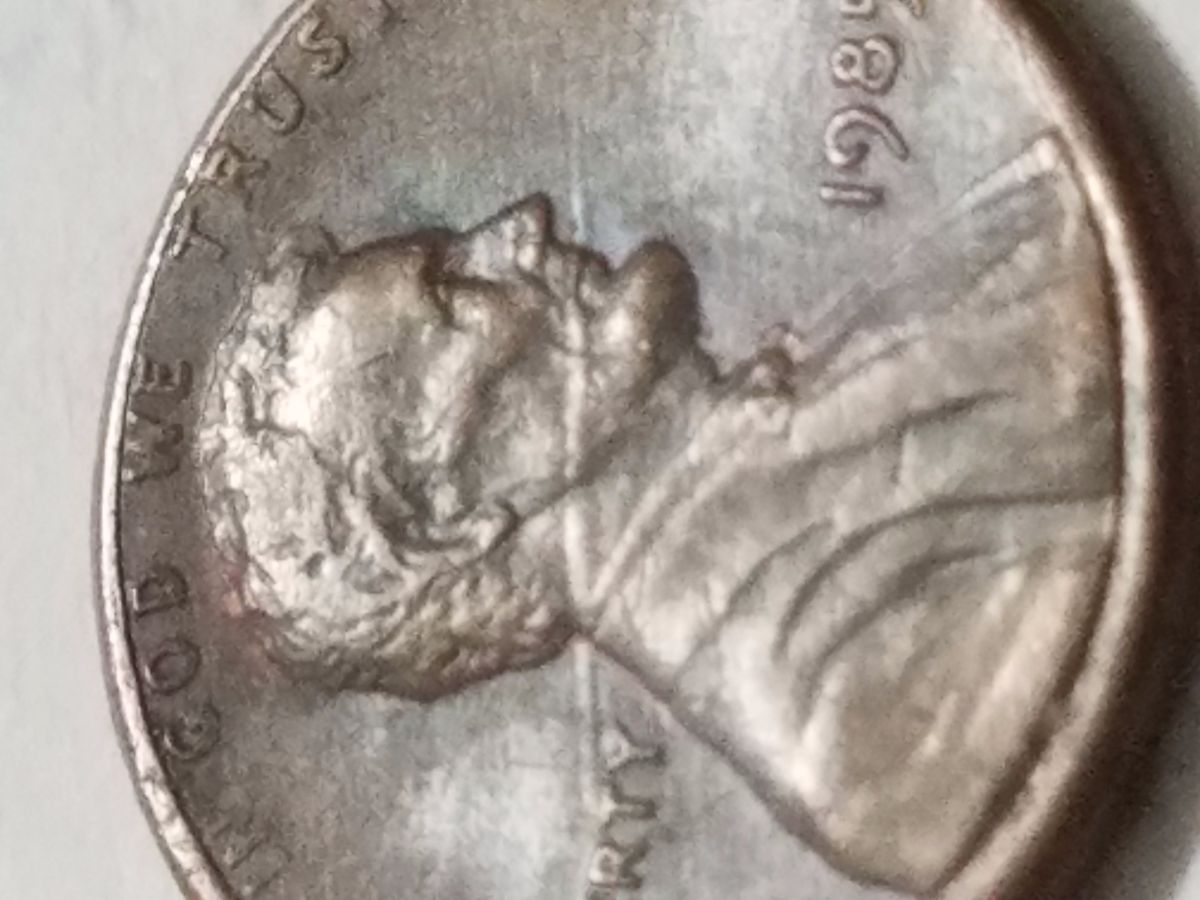 1985-Lincoln-Penny-Speared-From-Neck-Trough-Mout.
