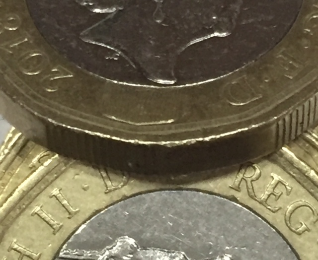 A-Couple-Of-GB-£1-Coins-With-Errors