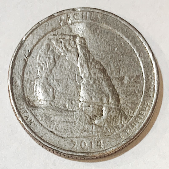 2014-Utah-State-Quarter-Struck-Through-Grease?