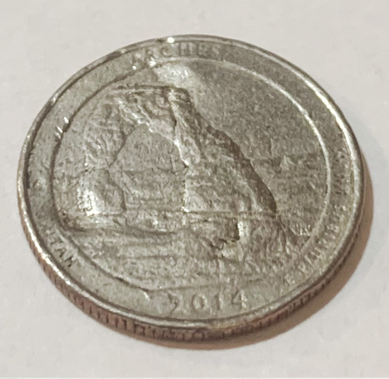 2014-Utah-State-Quarter-Struck-Through-Grease?