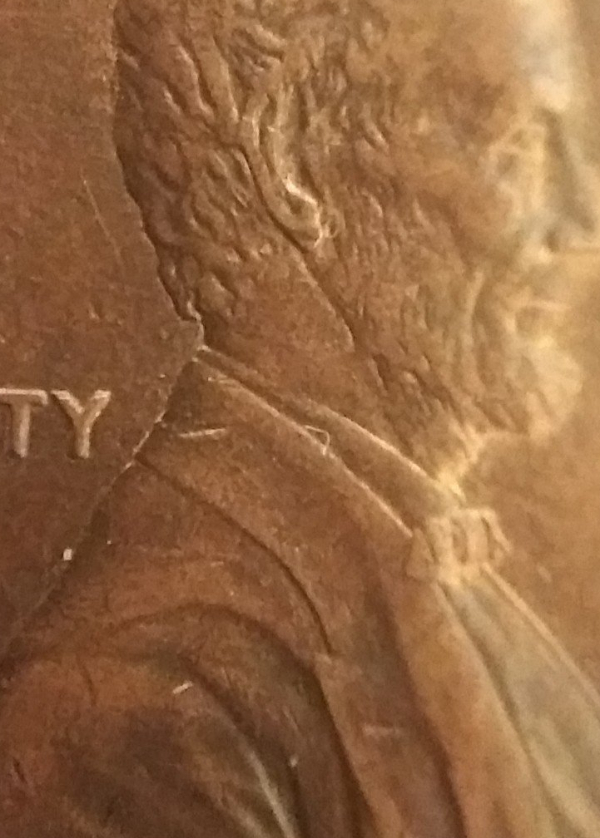 Extra-Earlobe-On-1990-D-Lincoln-Penny
