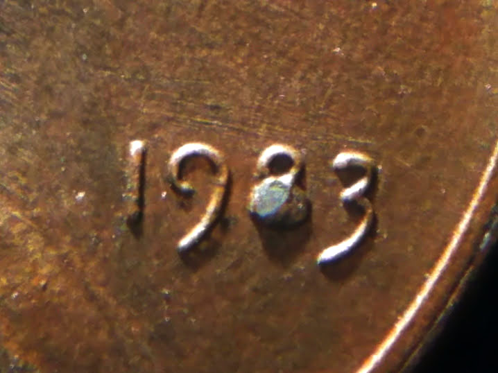 1983-Penny-With-Melted-8-And-A-Possible-Crack-In-The-Back.