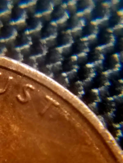 1987-Penny-With-Melted-Dot-Next-To-7.