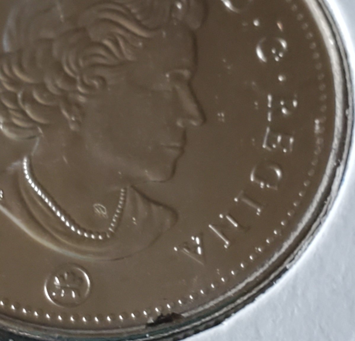 2021-50-Cents-Queen-Version,-Obverse-Struck-Through-Retained-Grease?