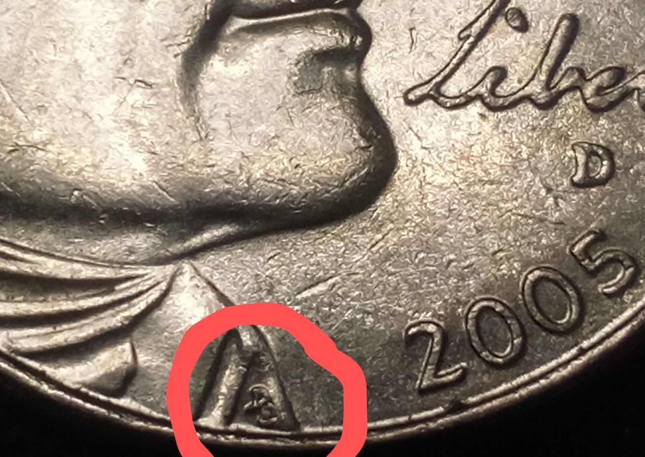 Marking-On-Bottom-Right-Sleeve-Of-2005-D-Nickel