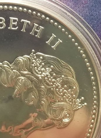 1976-Dollar-With-Varying-Sizes-Of-Beads-On-Rim