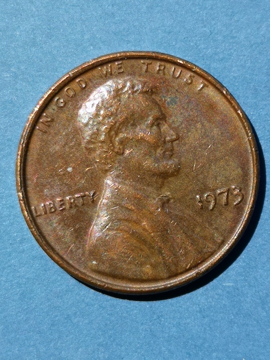 Lincoln-Cent-1973.reverse-*-Of-*-A-Line-Clipped-Through-The-O-And-Down-Into-Pluribus