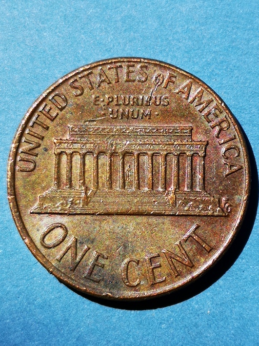 Lincoln-Cent-1973.reverse-*-Of-*-A-Line-Clipped-Through-The-O-And-Down-Into-Pluribus