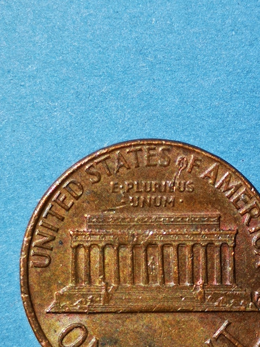 Lincoln-Cent-1973.reverse-*-Of-*-A-Line-Clipped-Through-The-O-And-Down-Into-Pluribus