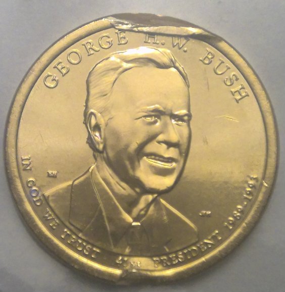 George-H.-W.-Bush-Dollar-Coin-With-Die-Damage