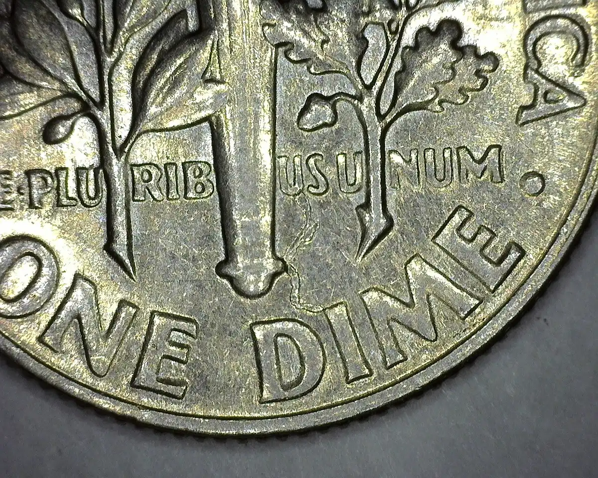 1965-Dime-Struck-Through-Debris