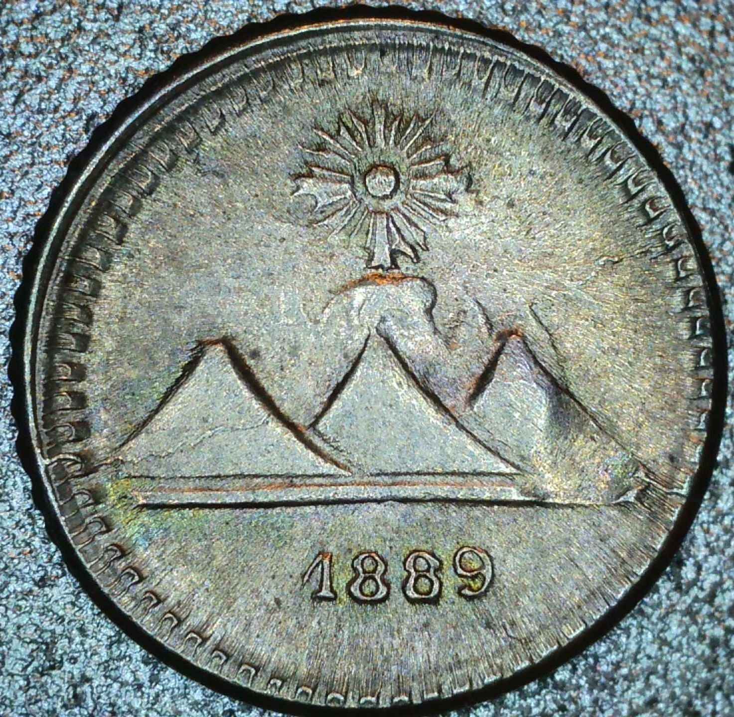 1889-Guatemalan-1/4-Real-With-Advanced-Die-Deterioration.