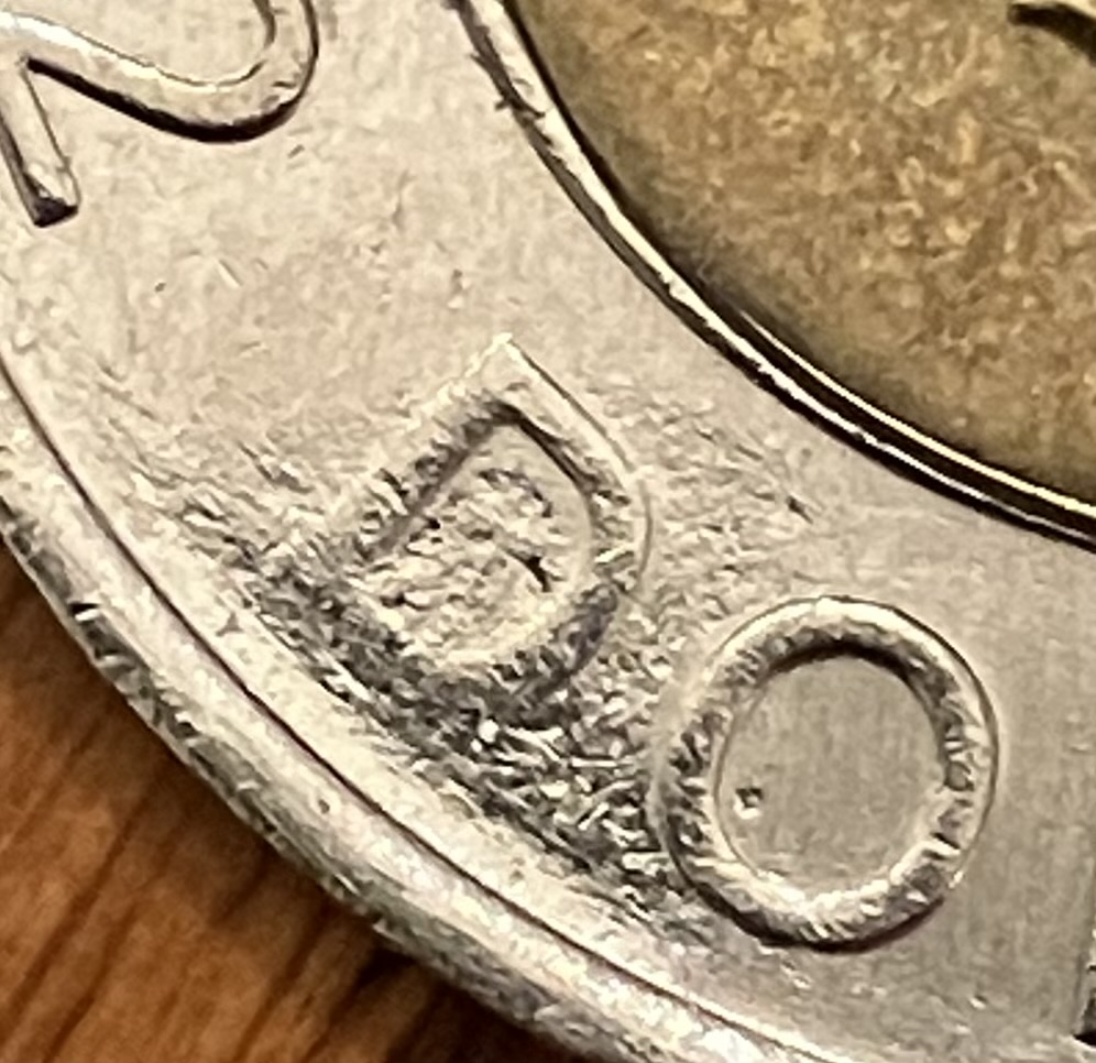 2000-Toonie:-Is-This-An-Error-Or-Post-Mint-Damage?