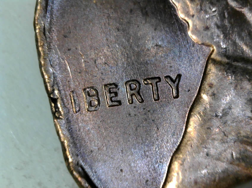 1957-D-Cent-Clipped-Planchet-With-Blakesly-Effect