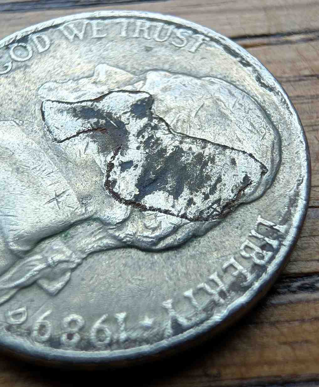 Jefferson-Nickel-Struck-In-Metal-Fragment