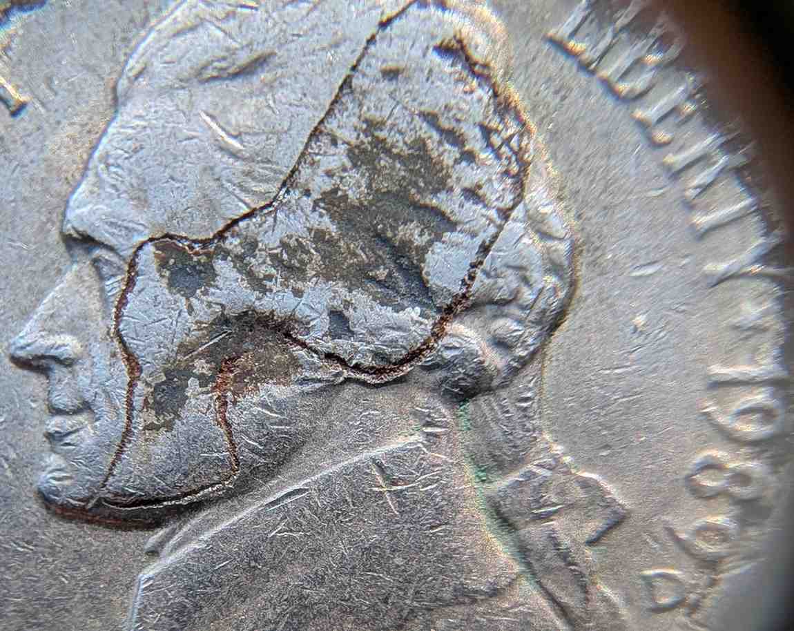 Jefferson-Nickel-Struck-In-Metal-Fragment