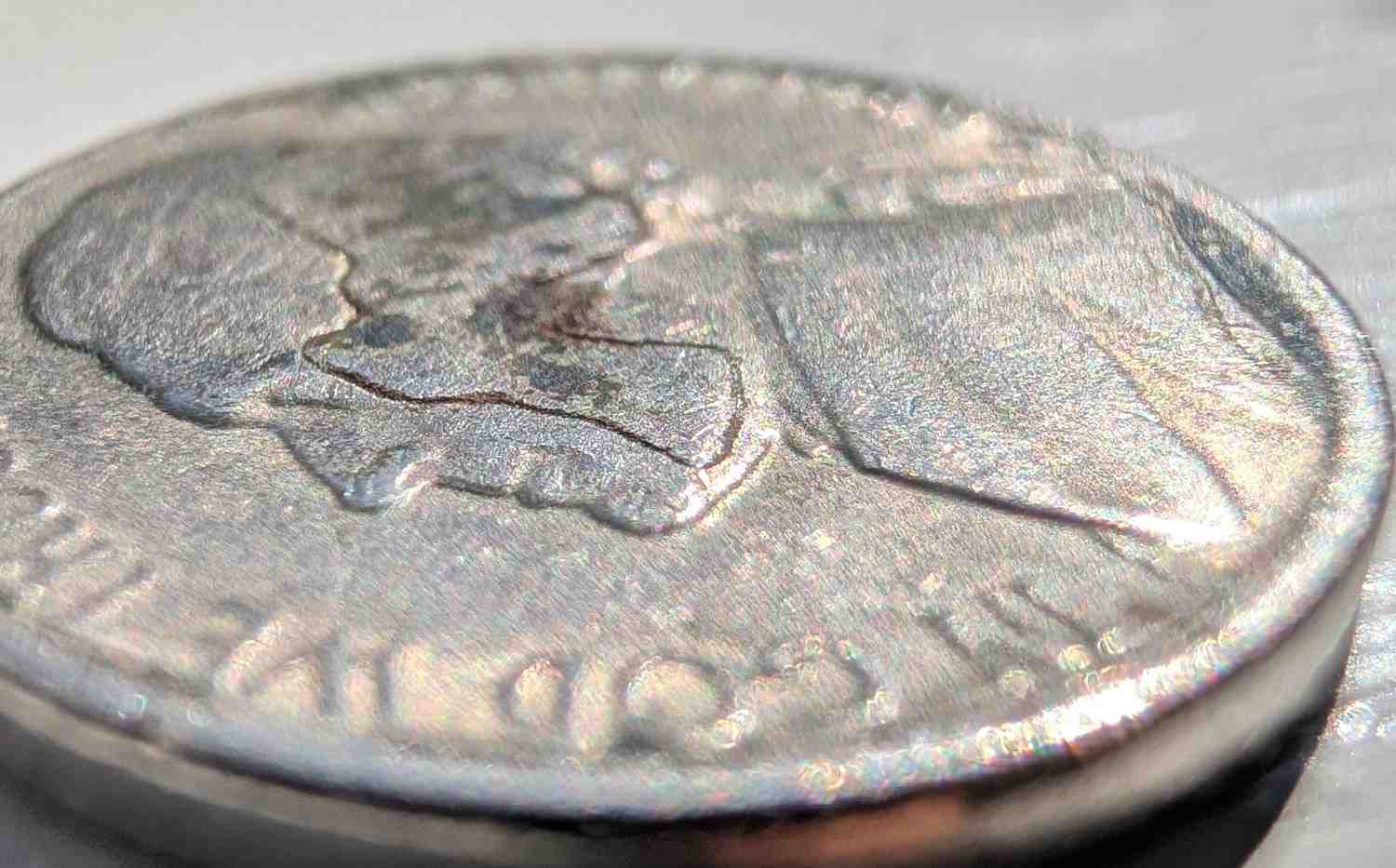 Jefferson-Nickel-Struck-In-Metal-Fragment