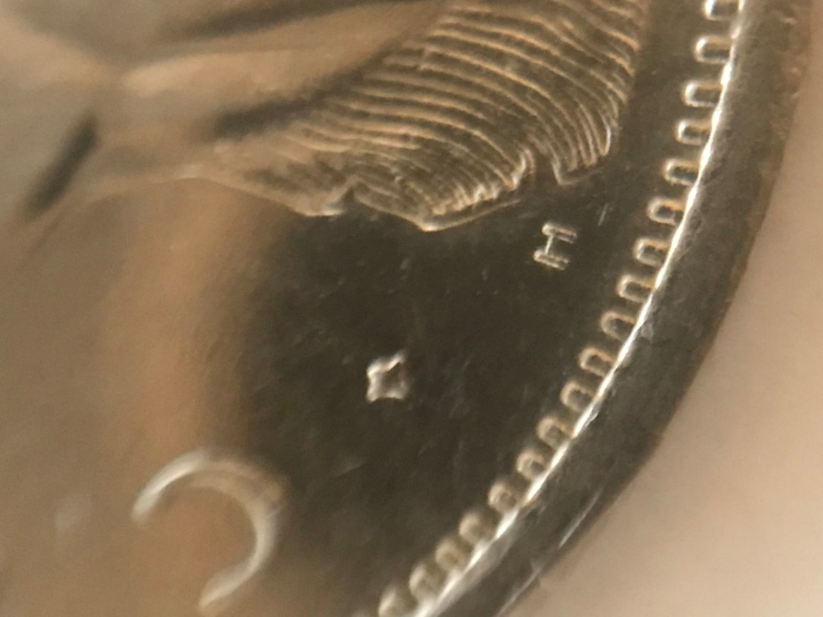 1975-25-Cents-Clipped-Planchet---Specimen-Strike