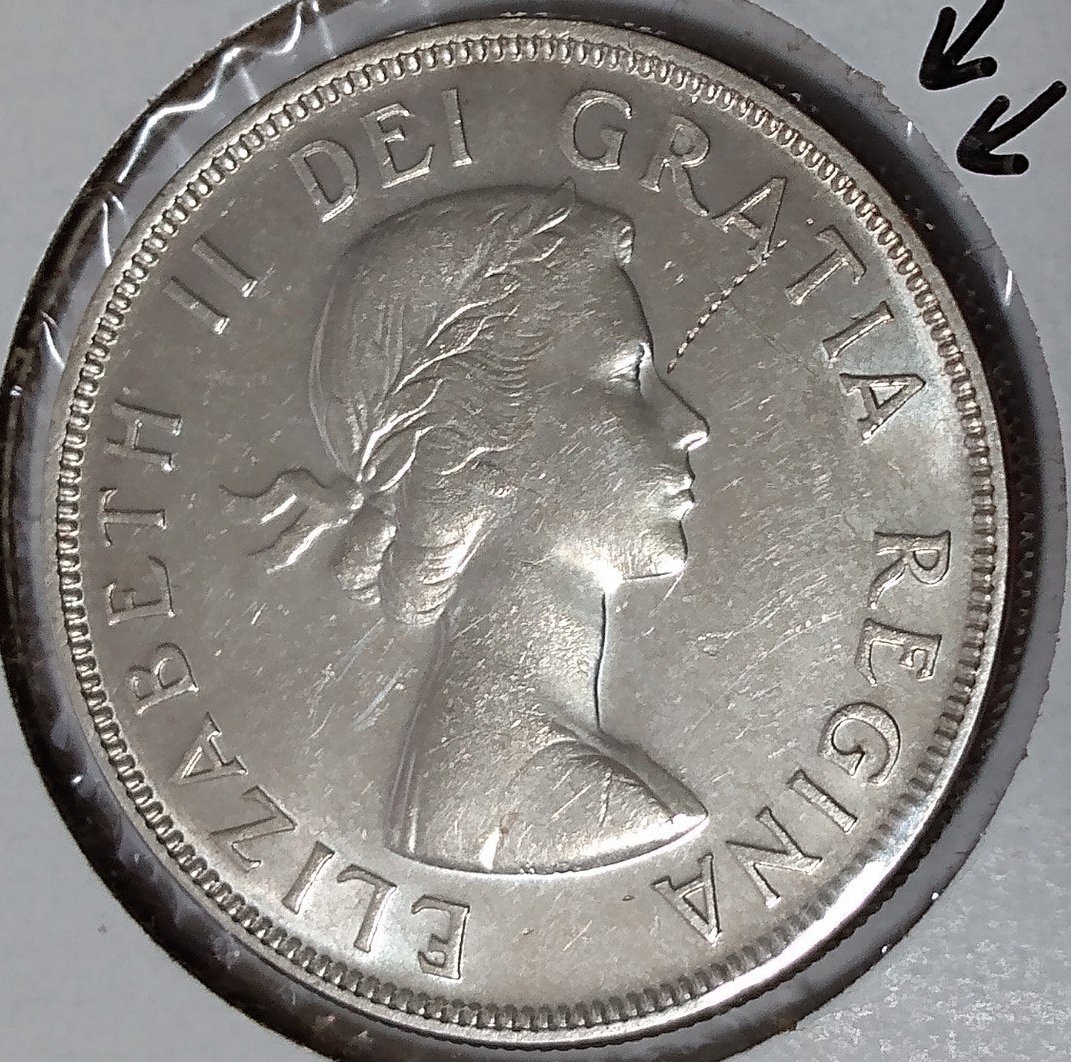 1955-Silver-Dollar-Struck-Through-Wire-On-Obverse-Close-Up-Pictures