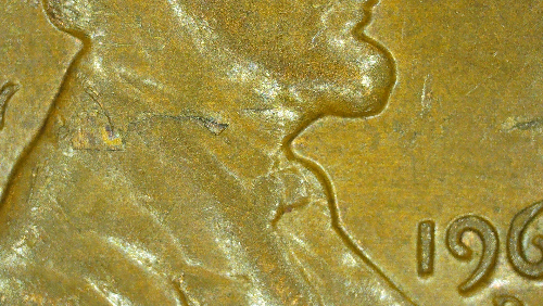 1962-D-Lamination-On-Obverse-Through-Liberty