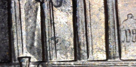 1993-One-Cent-Stike-Through-Debris?