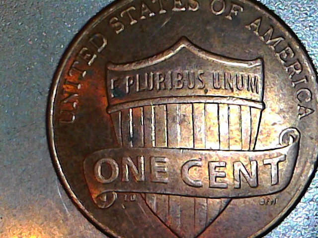 How-To-Tell-Between-A-Strike-Through-And-Post-Mint-Damage-2011-Cent