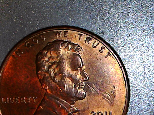 How-To-Tell-Between-A-Strike-Through-And-Post-Mint-Damage-2011-Cent