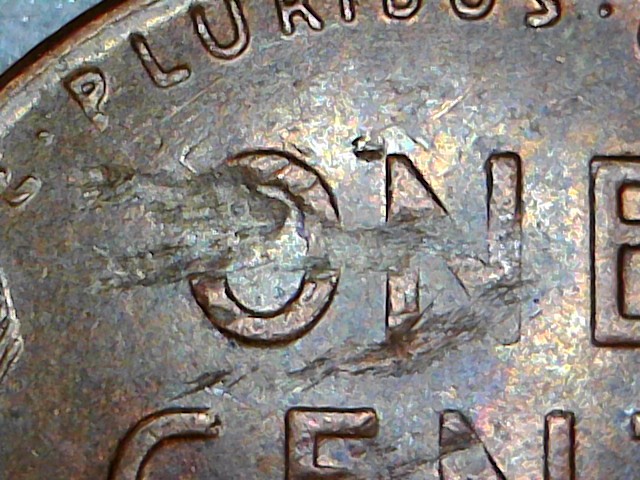 1957-D-Bie,-Plus-Struck-Thru-Debris,-Plus-Lamination,-Plus-Struck-Thru?