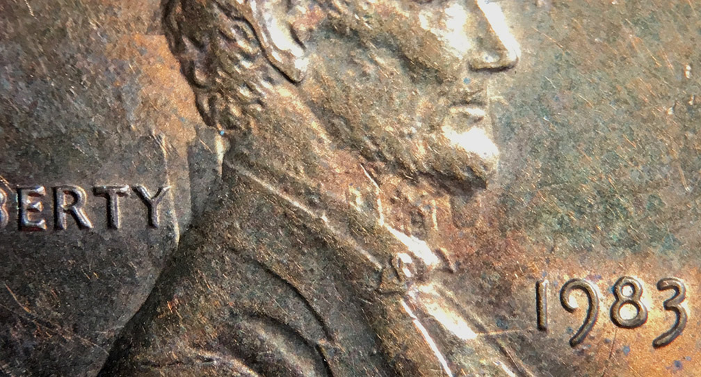 1983-LMC-Obverse-Die-Clash-On-Field-And-Bust