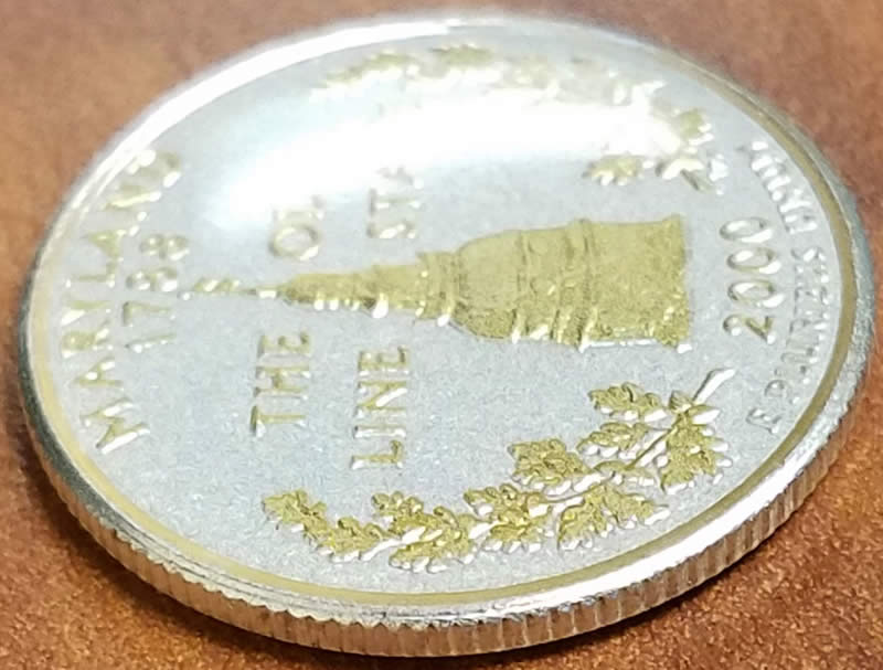 2000-Maryland-State-Quarter-With-Odd-Yellow-Tint-And-Plastic-Coating