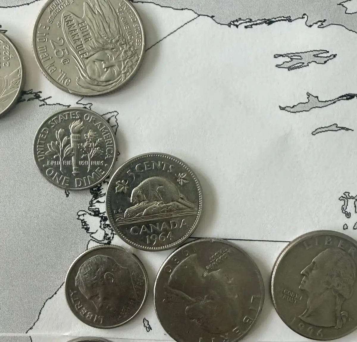 Working-On-A-World-Map-Made-Of-Coins.