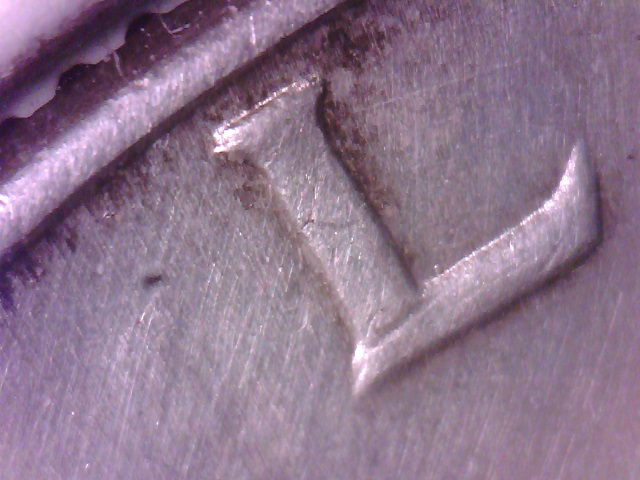 1964-D-Kennedy-Half-With-Some-Notching....common?