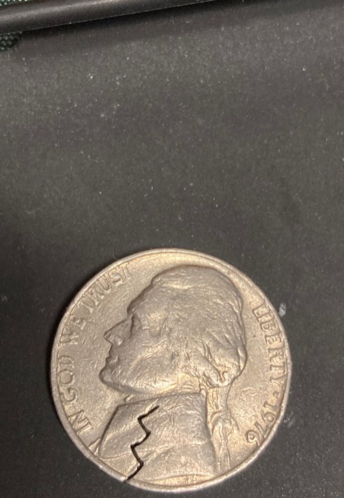 1991-Jefferson-Nickel?-I've-Read-That-The-Slit-May-Be-From-A-Staple?
