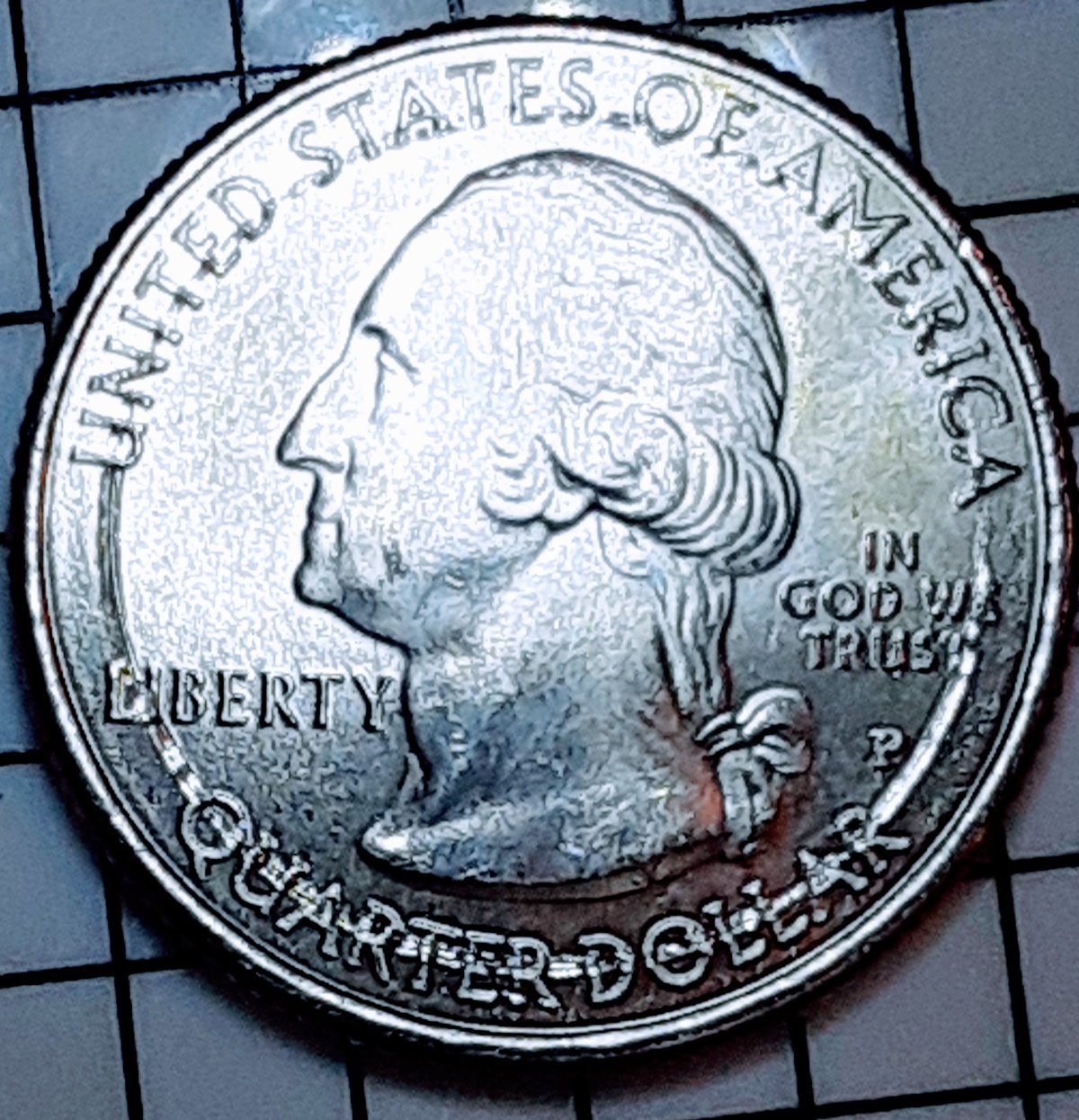 2021-Quarter-With-Marks-Underneath-Letters?