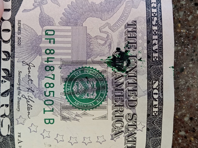Green-Ink-Splatters-On-A-$5-Bill