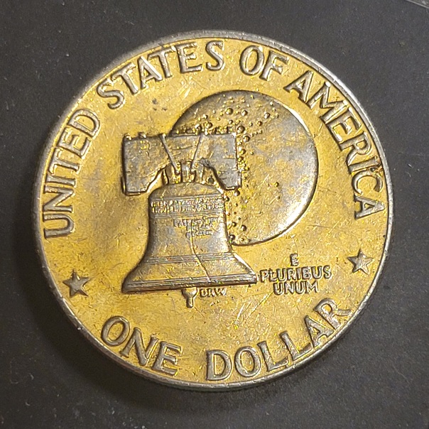 1976-Eisenhower-Dollar-Can't-Make-Out-A-MM-Gold-Plated-Maybe