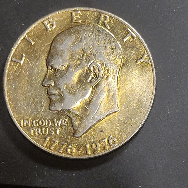 1976-Eisenhower-Dollar-Can't-Make-Out-A-MM-Gold-Plated-Maybe