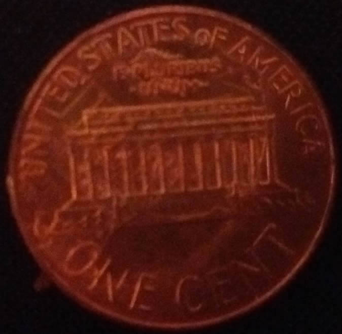 2007-Penny-Messed-Up-Looking-Is-This-From-Glue-Or-Some-Kind-Of-Other-Damage